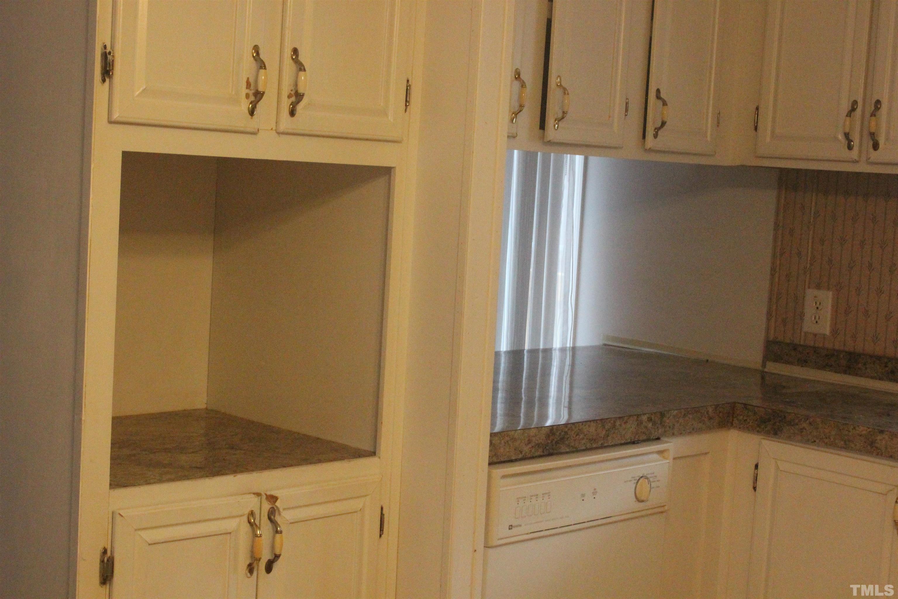 2986 Thomas Road Henderson, NC 27537 - Photo 18 of 21 a bathroom with a granite countertop cabinets and a sink