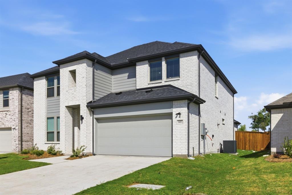 637 Sierra Ridge Lavon, TX 75166 - Photo 2 of 26 a front view of a house with a yard