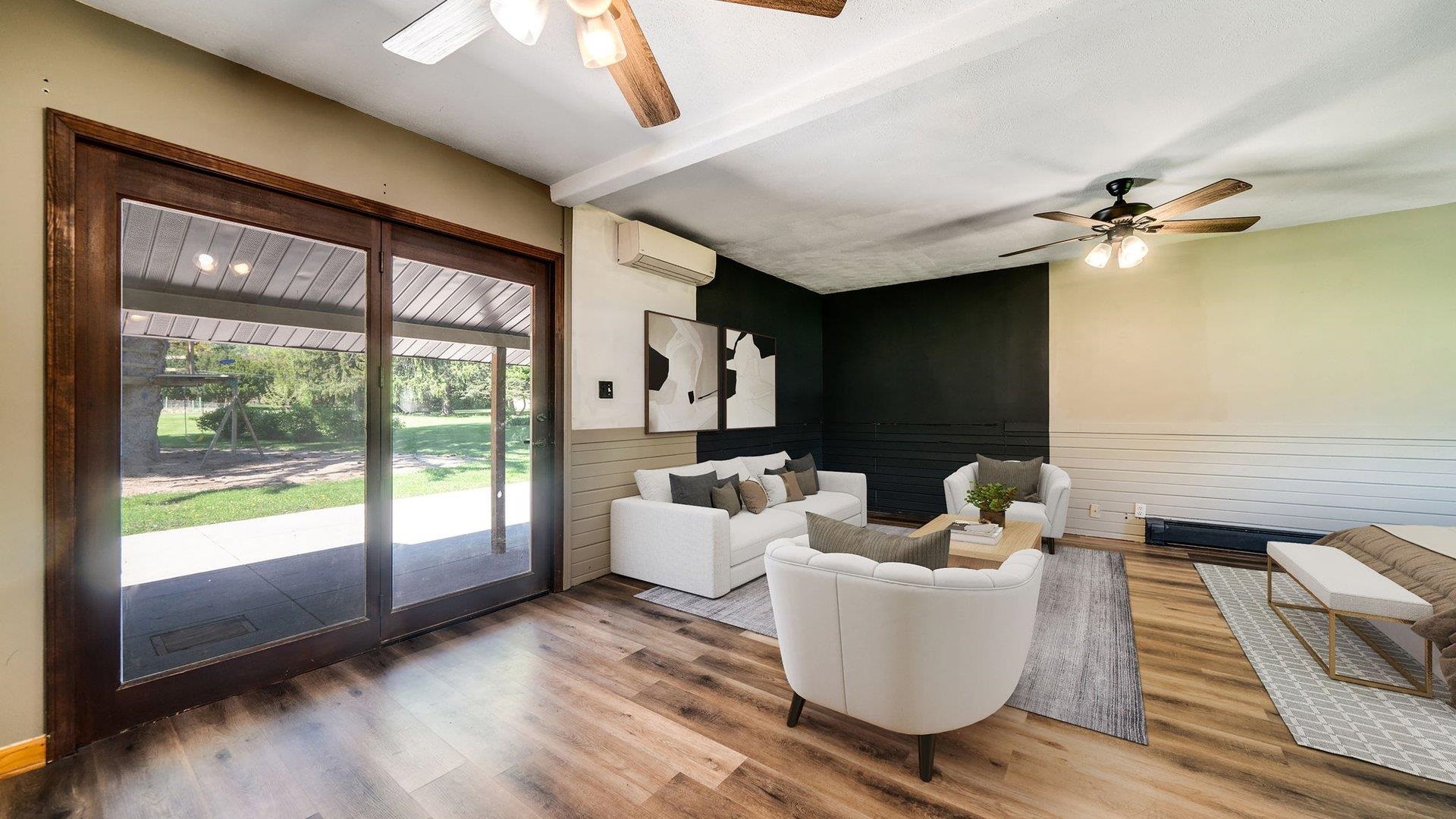 313 West Margaret Fuller Road Oregon, IL 61061 - Photo 16 of 46 a living room with furniture and a large window