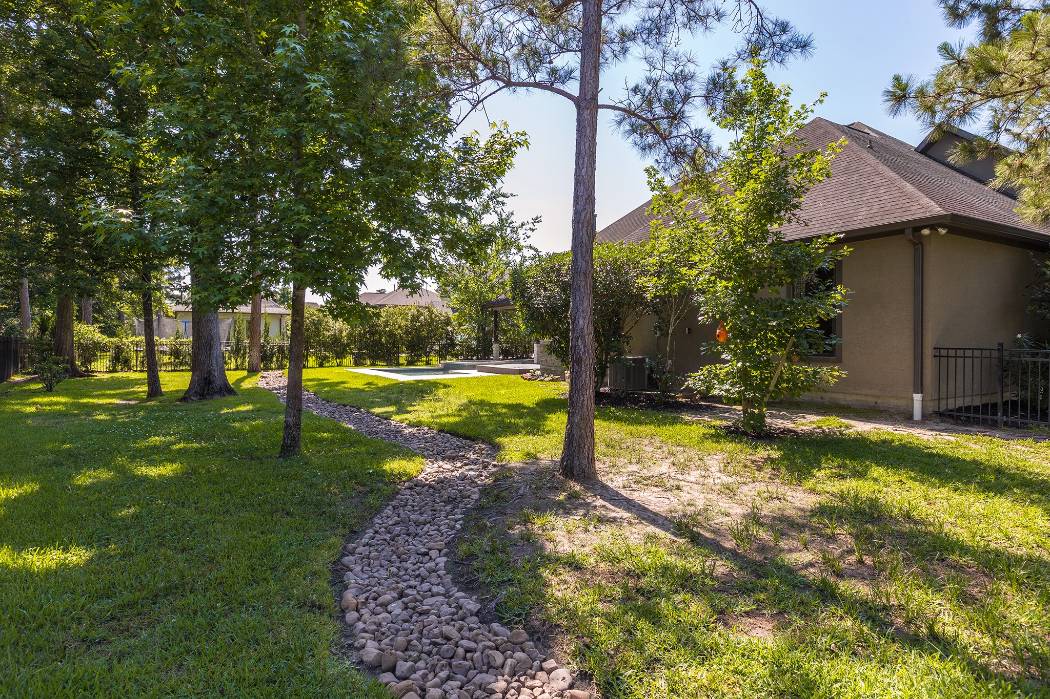5507 Bright Timber Landing Drive Spring, TX 77386 - Photo 40 of 45 Dry rock bed to keep backyard dry throughout rainy seasons!