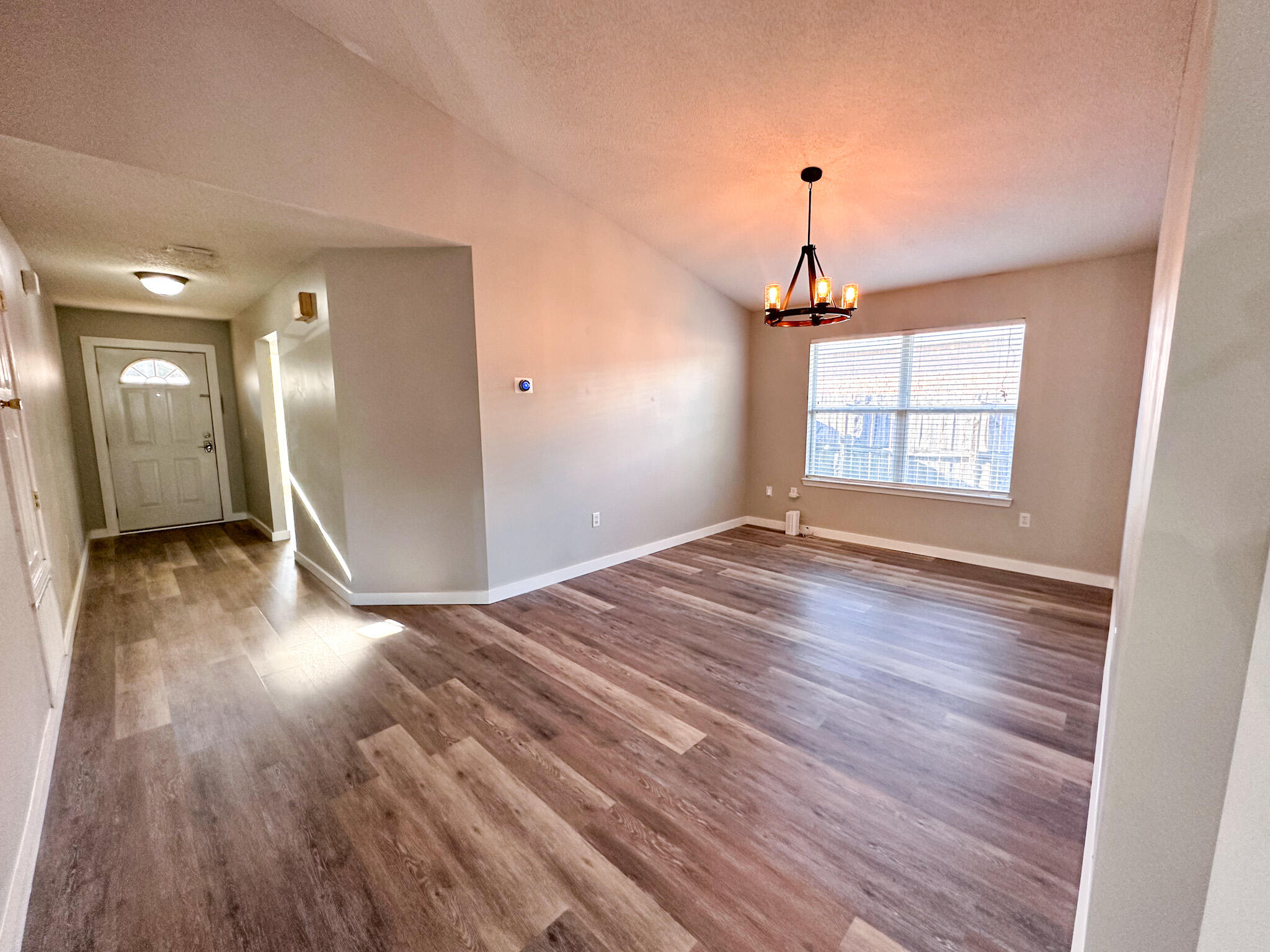 269 Limestone Circle Crestview, FL 32539 - Photo 12 of 32 a view of empty room with wooden floor and fan