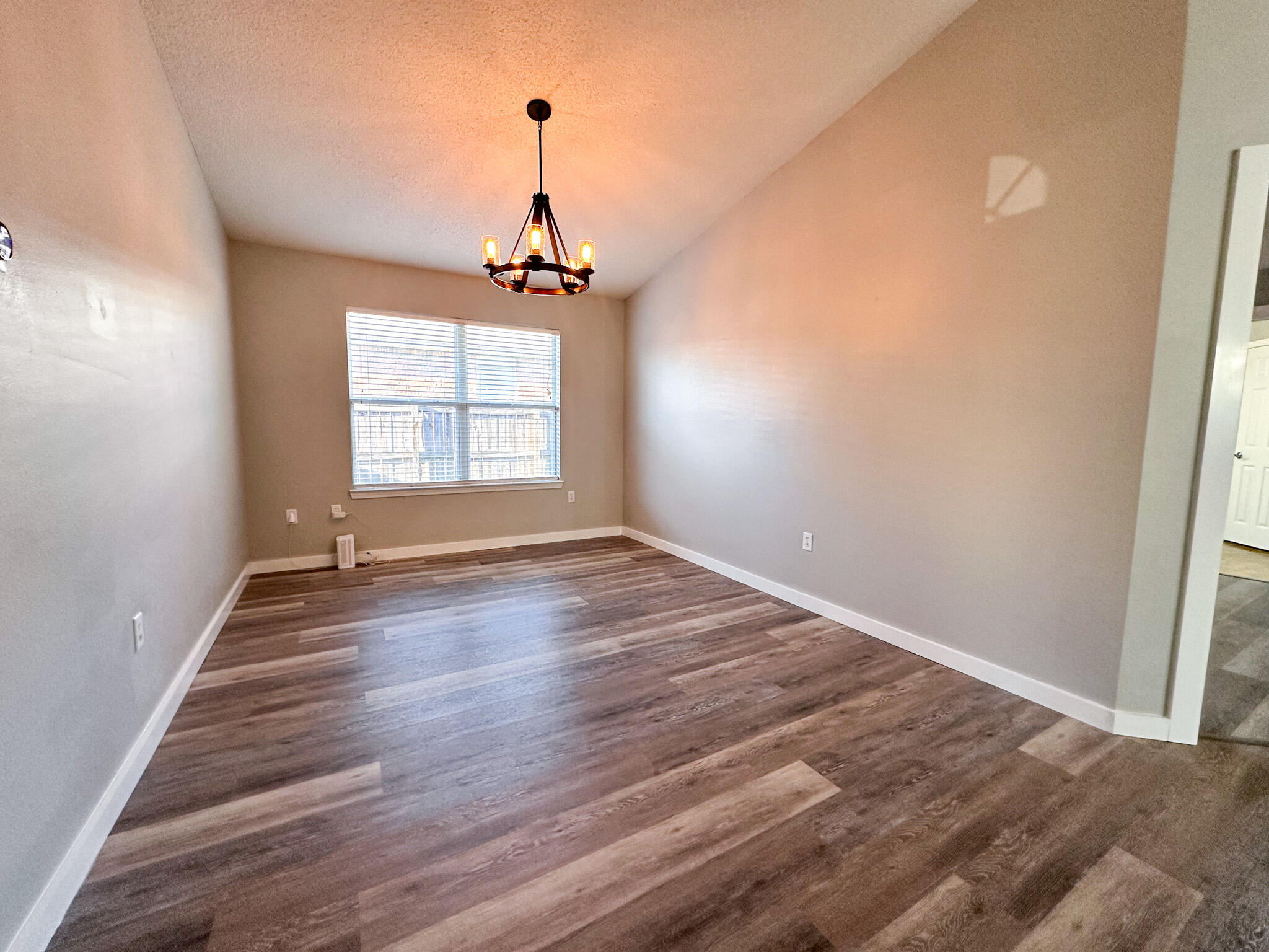 269 Limestone Circle Crestview, FL 32539 - Photo 19 of 32 an empty room with wooden floor and windows