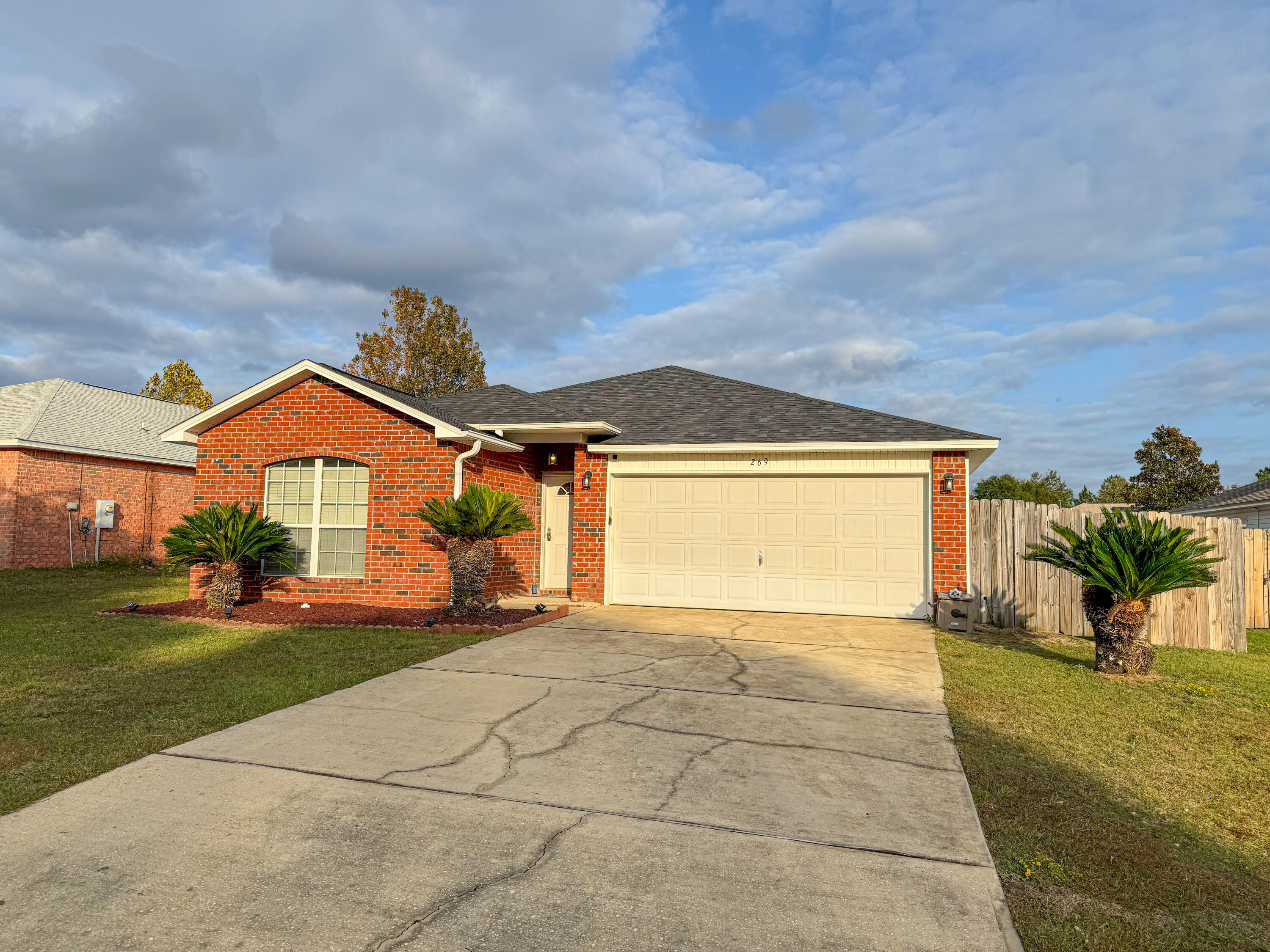 269 Limestone Circle Crestview, FL 32539 - Photo 2 of 32 a view of a house with yard and a parking space