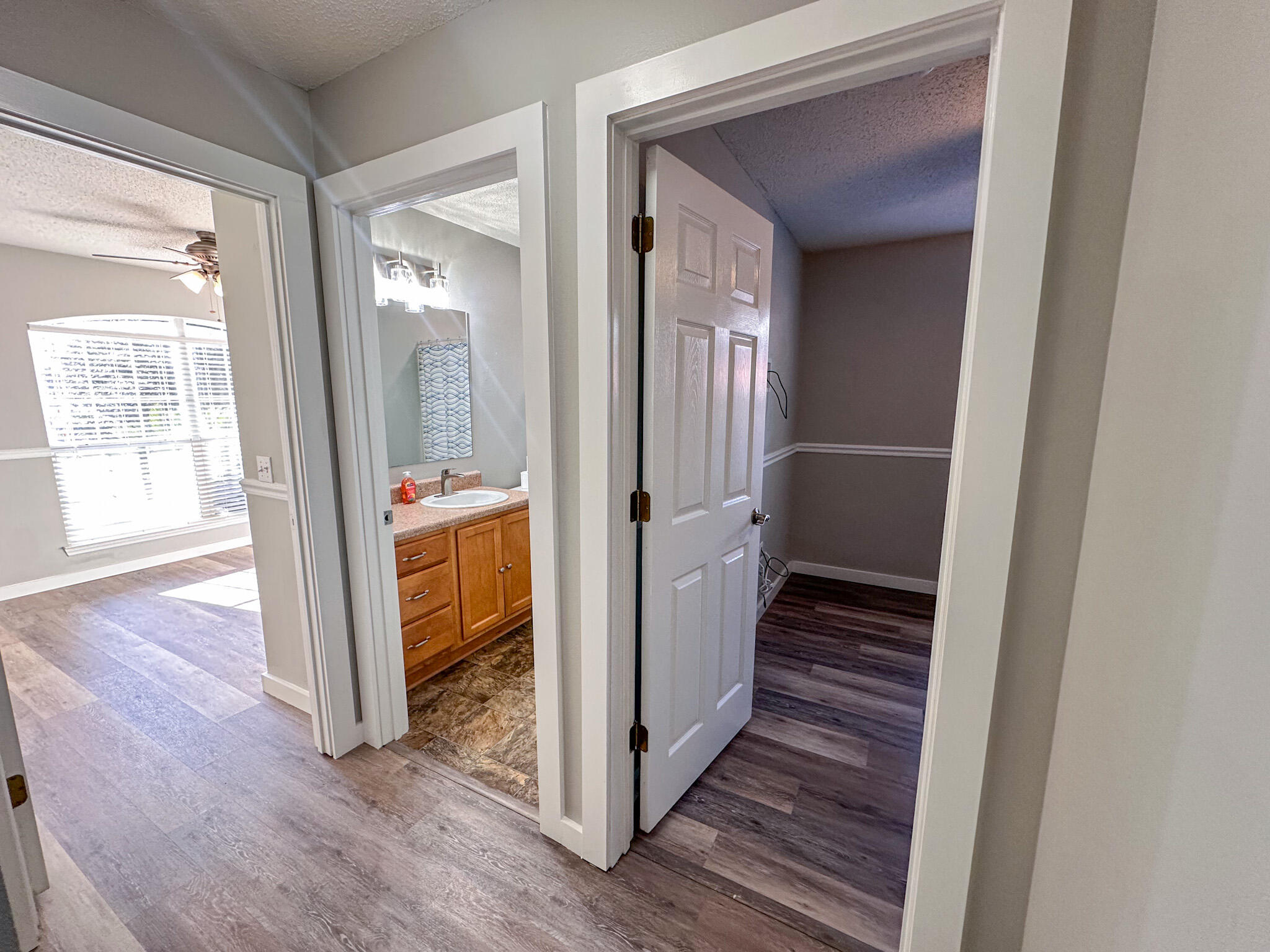 269 Limestone Circle Crestview, FL 32539 - Photo 25 of 32 a view of a hallway with wooden floor and staircase