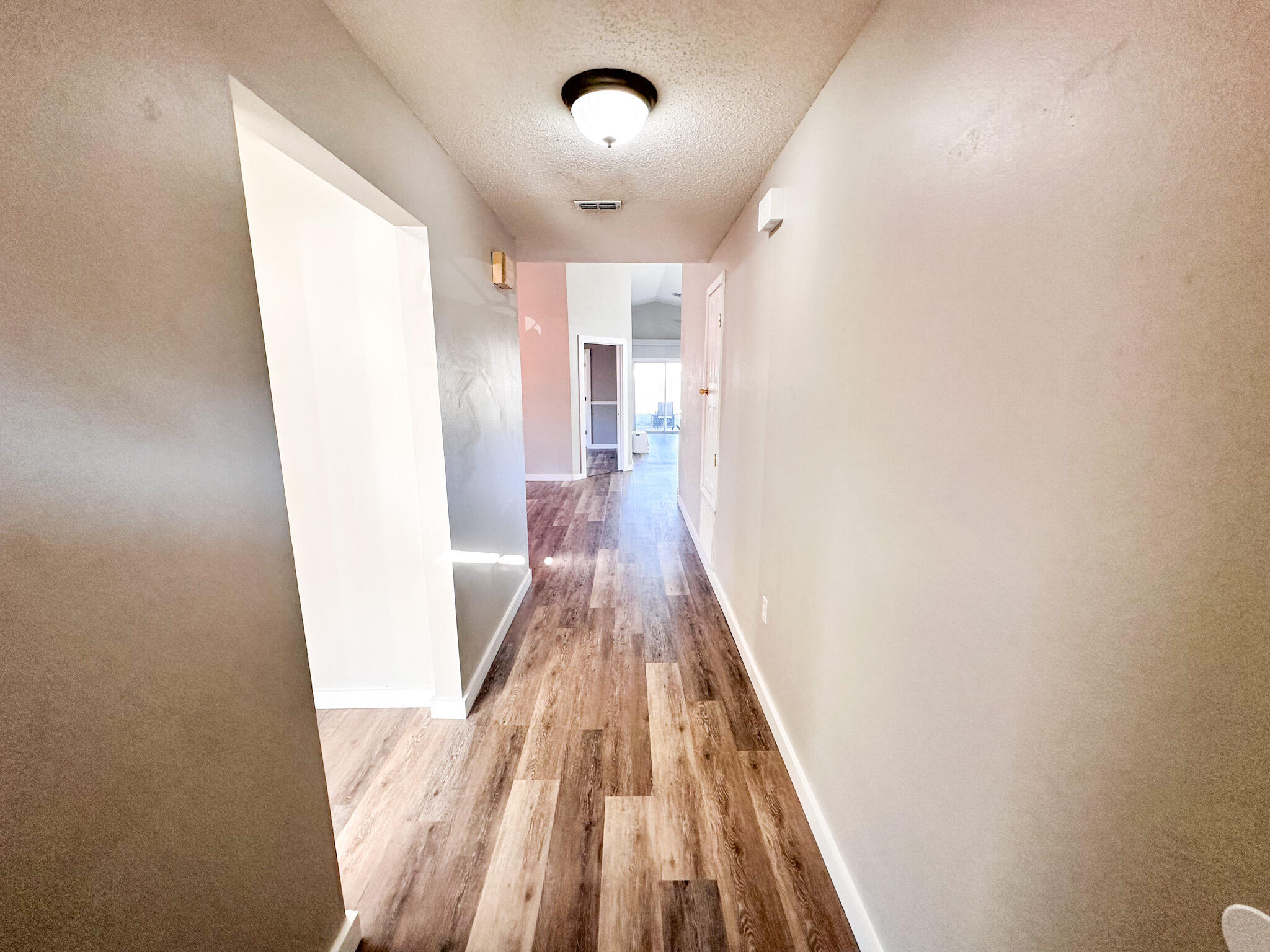 269 Limestone Circle Crestview, FL 32539 - Photo 28 of 32 a view of a hallway with wooden floor