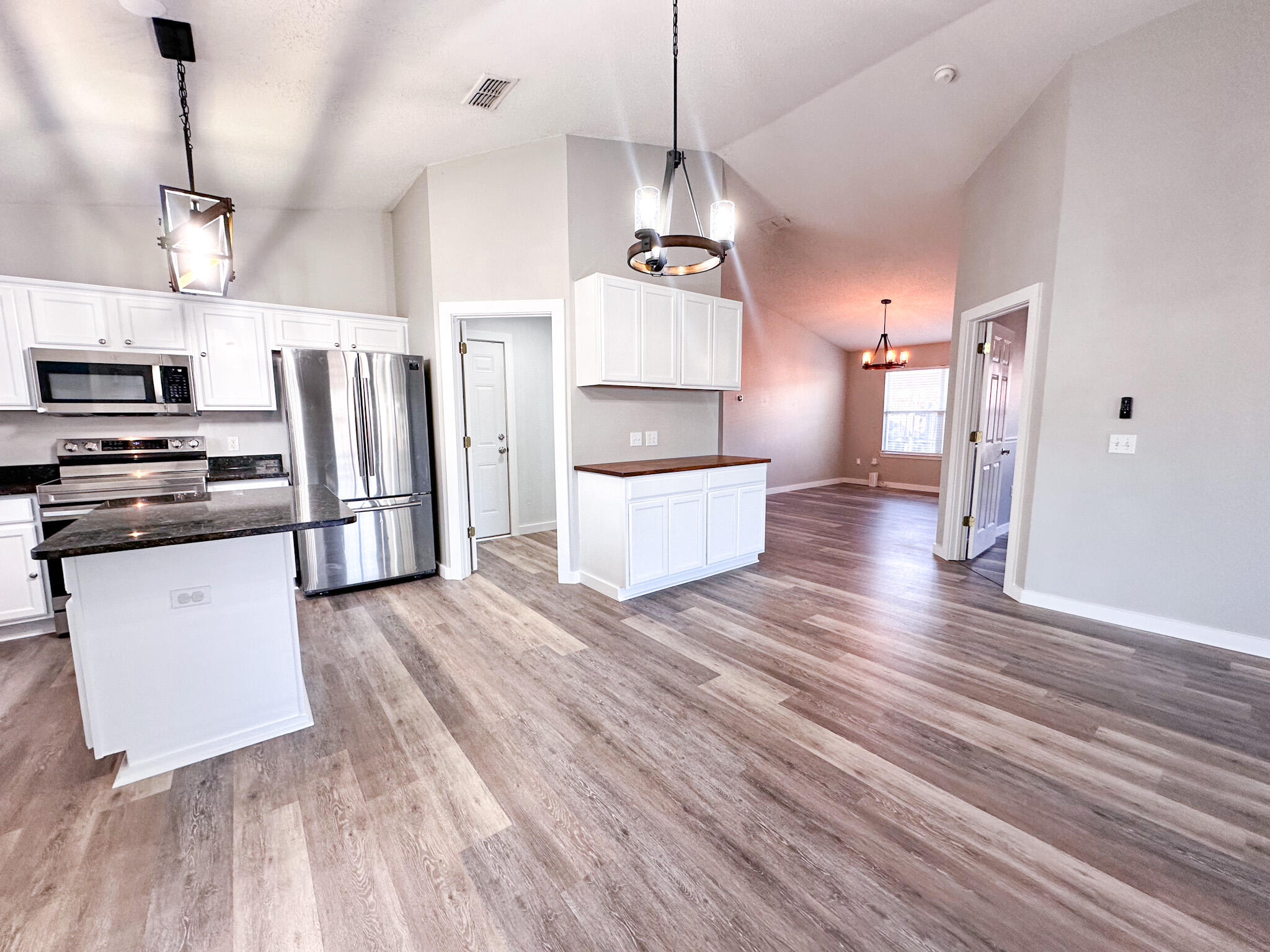 269 Limestone Circle Crestview, FL 32539 - Photo 9 of 32 a view of a kitchen with wooden floor and a sink