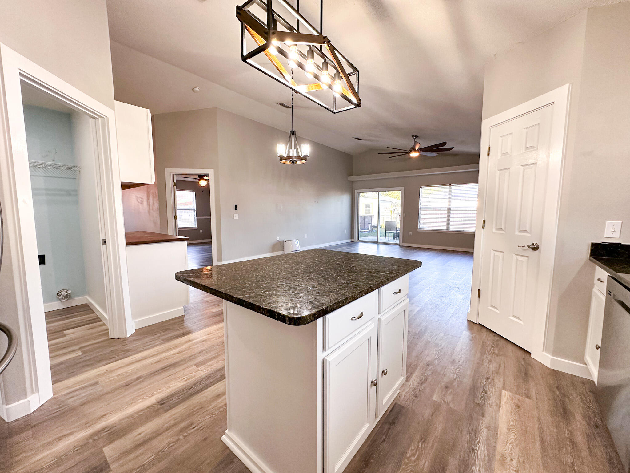 269 Limestone Circle Crestview, FL 32539 - Photo 10 of 32 a kitchen with a stove and a wooden floor