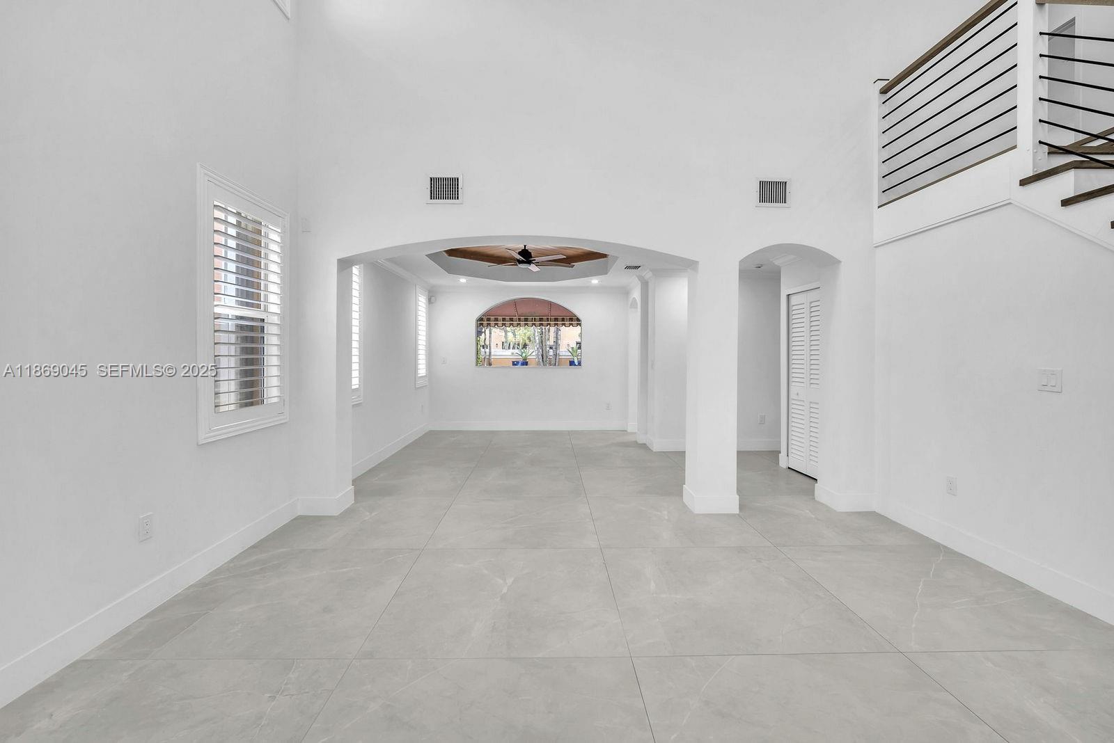 15244 Southwest 29th Terrace Miami, FL 33185 - Photo 12 of 74 a view of a hallway with windows