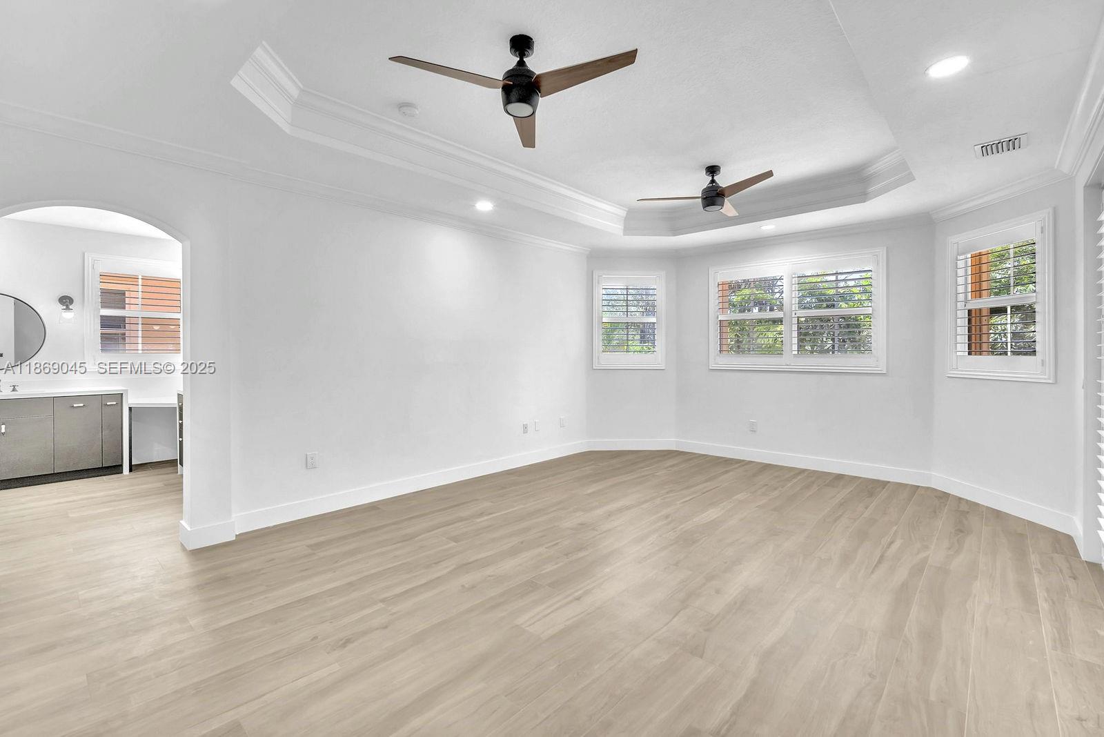 15244 Southwest 29th Terrace Miami, FL 33185 - Photo 30 of 74 wooden floor in an empty room with a window