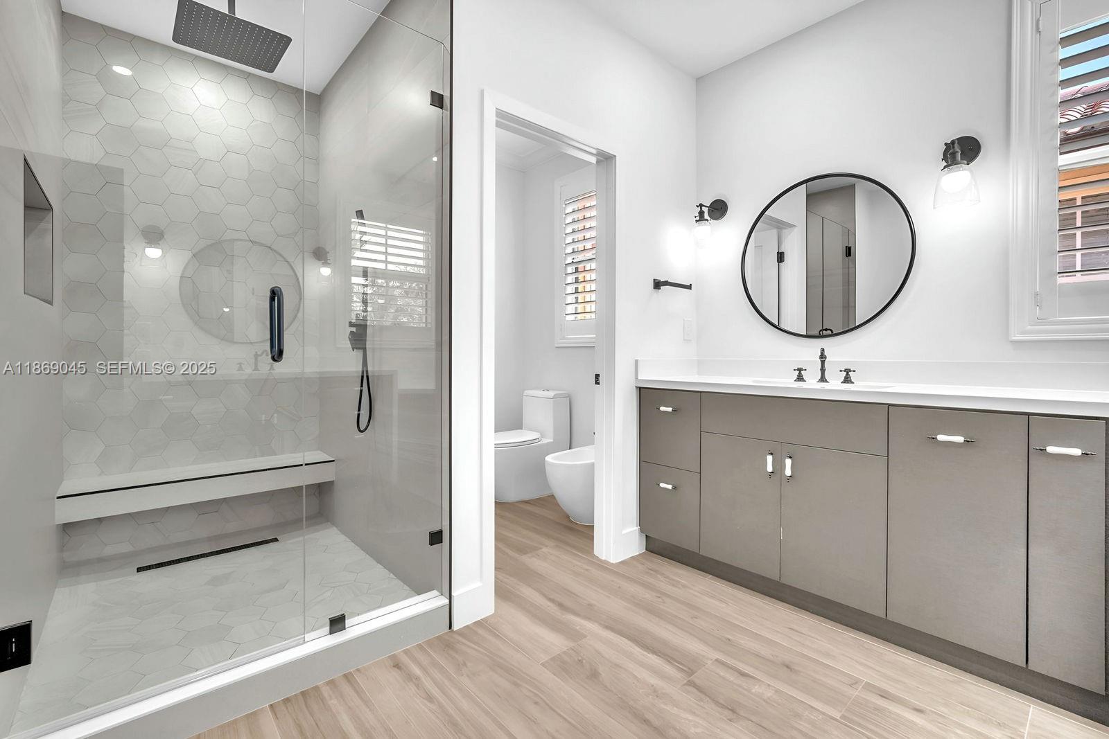 15244 Southwest 29th Terrace Miami, FL 33185 - Photo 33 of 74 a bathroom with a double vanity sink mirror and a toilet