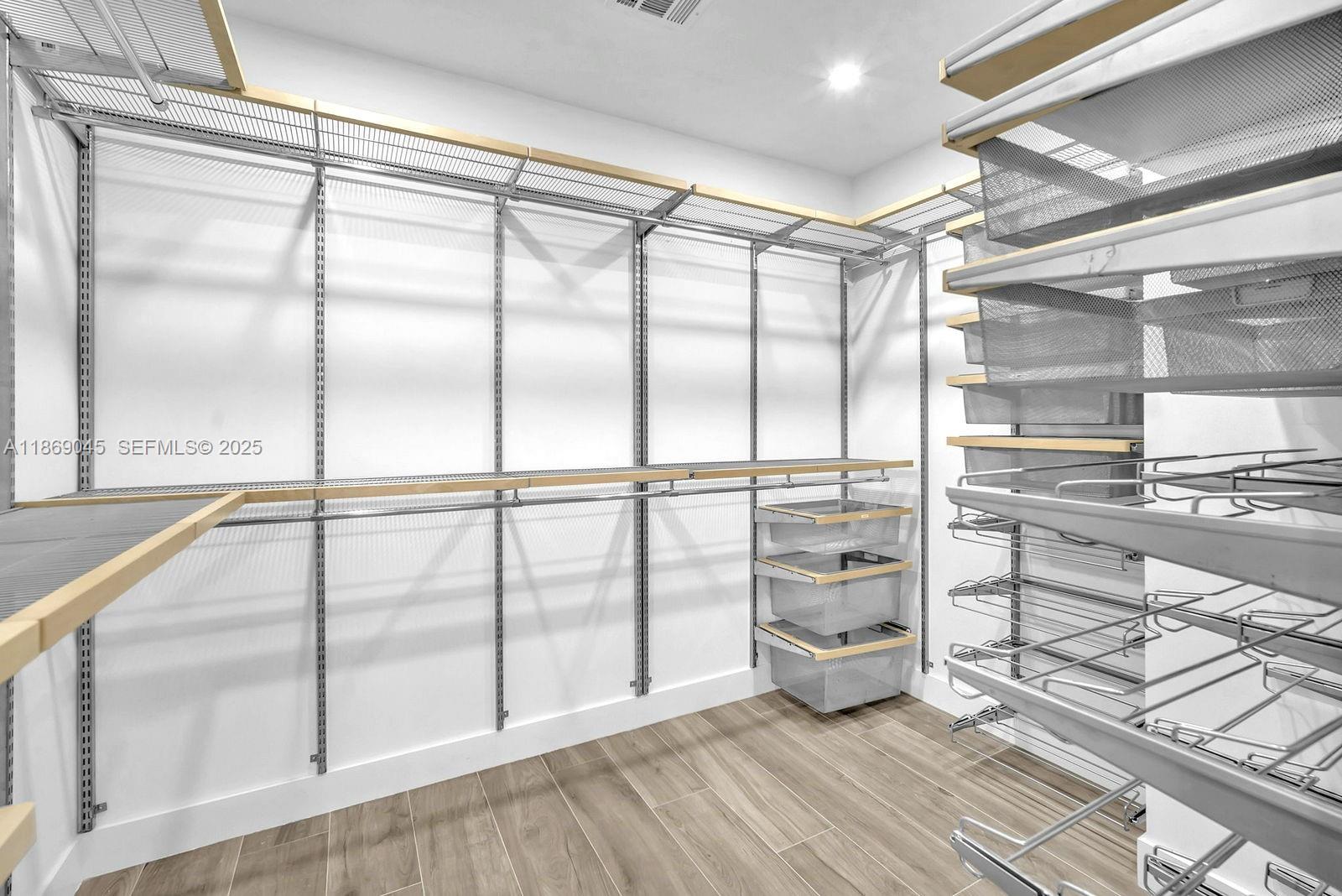 15244 Southwest 29th Terrace Miami, FL 33185 - Photo 36 of 74 a view of an empty room with wooden floor and windows