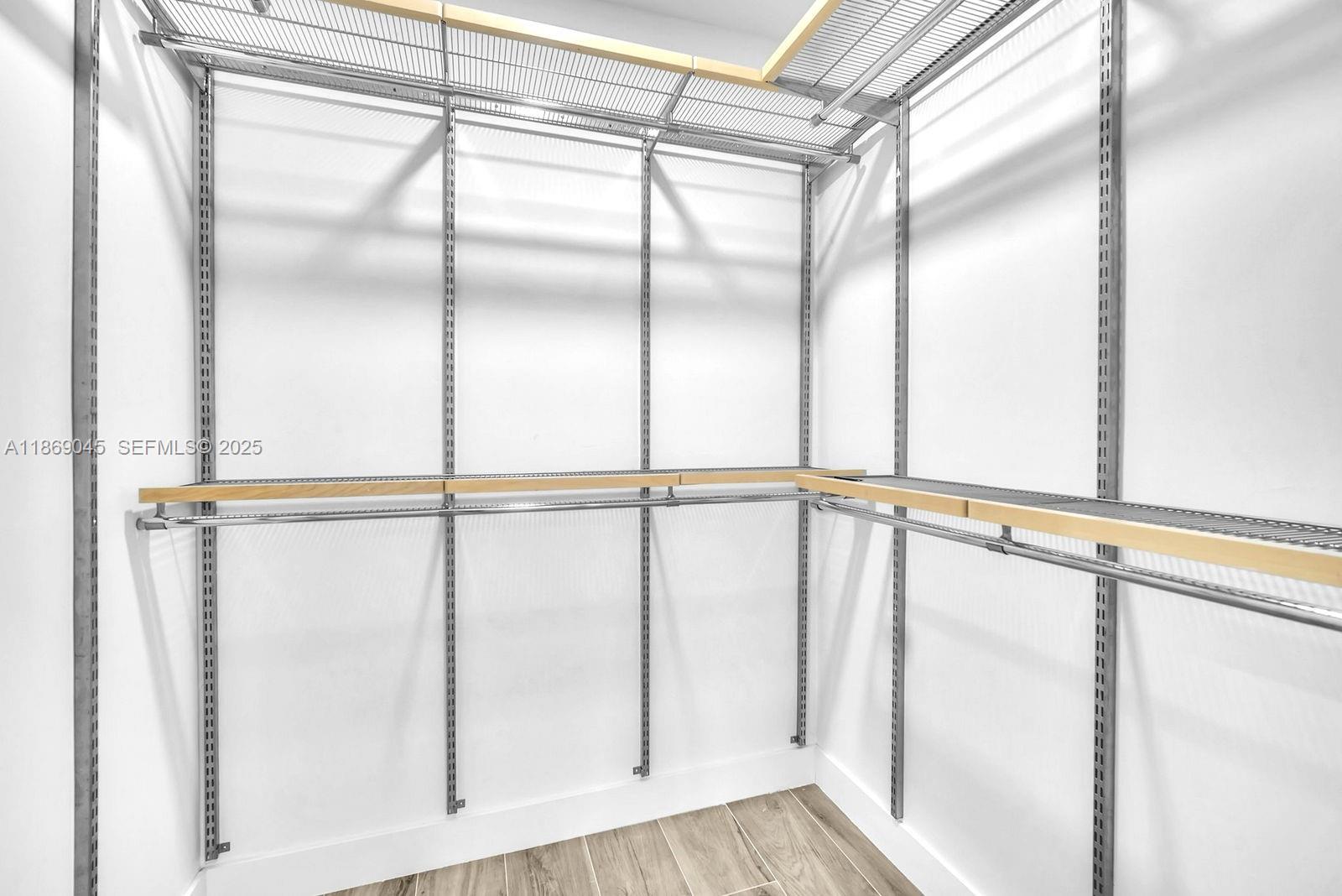 15244 Southwest 29th Terrace Miami, FL 33185 - Photo 47 of 74 a view of a room with wooden floor and white walls