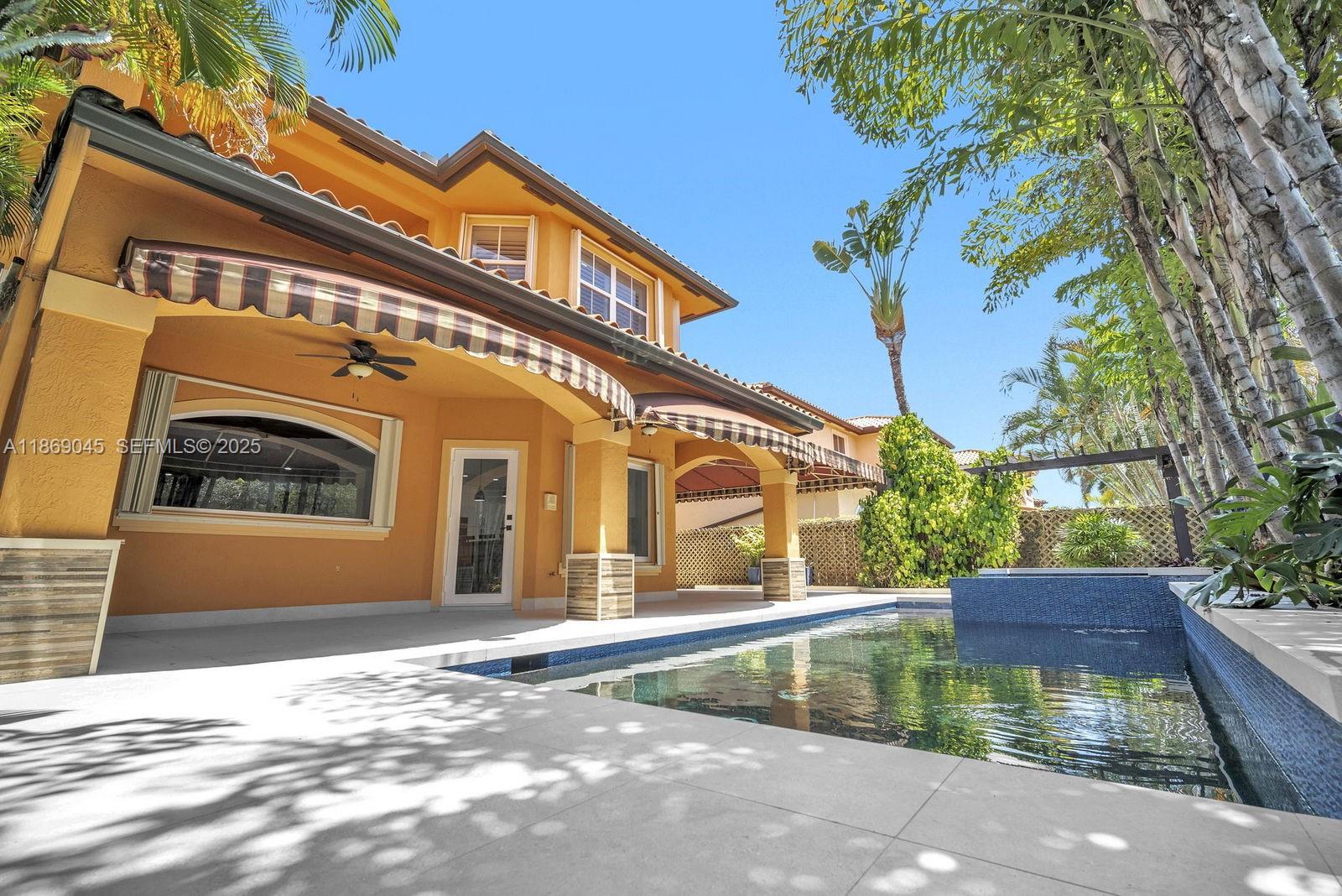 15244 Southwest 29th Terrace Miami, FL 33185 - Photo 56 of 74 a view of a building with a yard