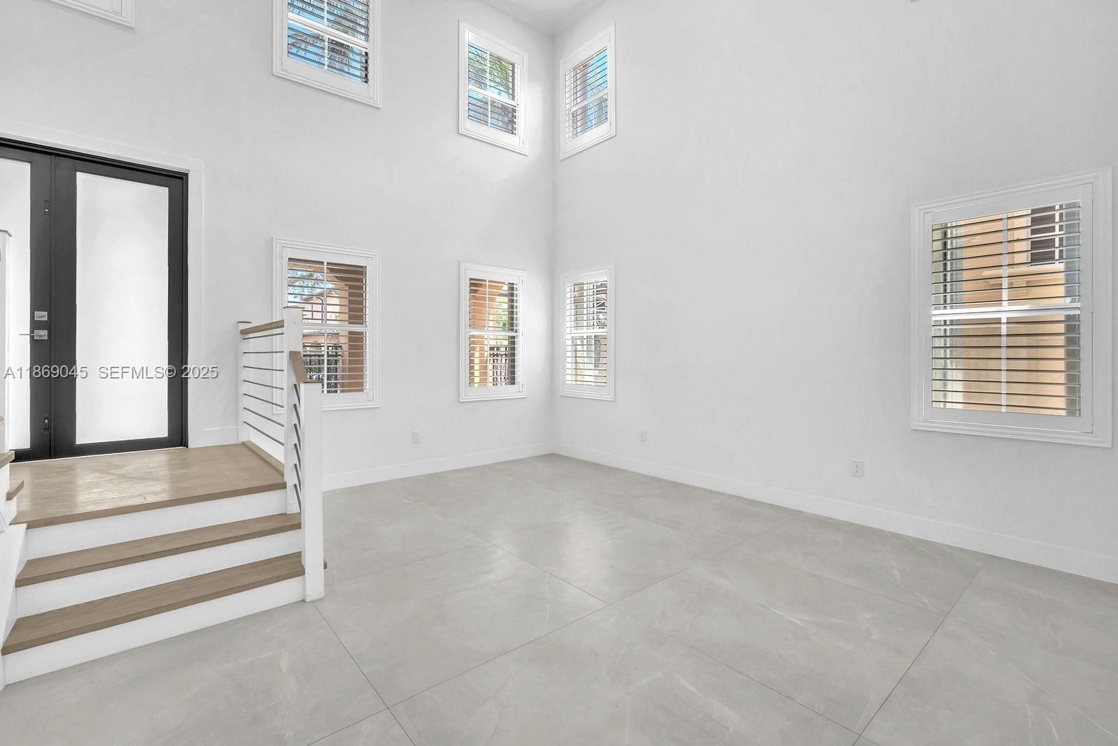15244 Southwest 29th Terrace Miami, FL 33185 - Photo 9 of 74 a view of an empty room with a window