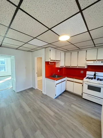 a view of utility room with kitchen