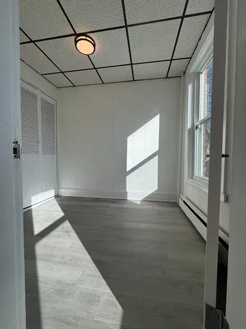 a view of a livingroom with a dishwasher and a window