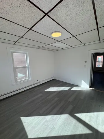 an empty room with wooden floor