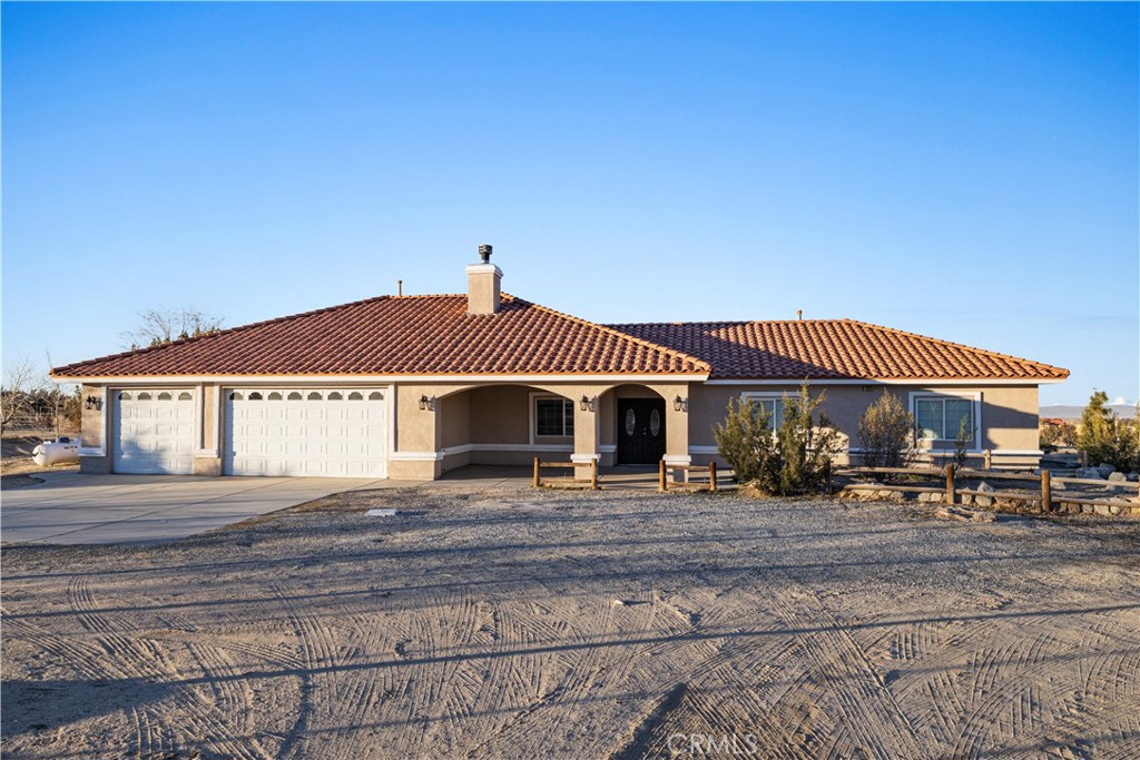 a front view of a house with yard