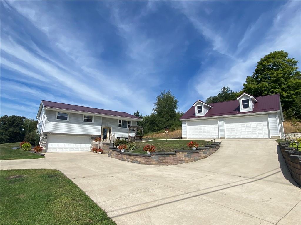 1009 Dutch Ridge Road Ellwood City, PA 16117 - Photo 1 of 12 a view of a house with outdoor space and sitting area