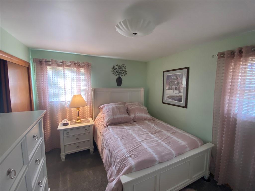 1009 Dutch Ridge Road Ellwood City, PA 16117 - Photo 5 of 12 a bedroom with a bed and a lamp on dresser