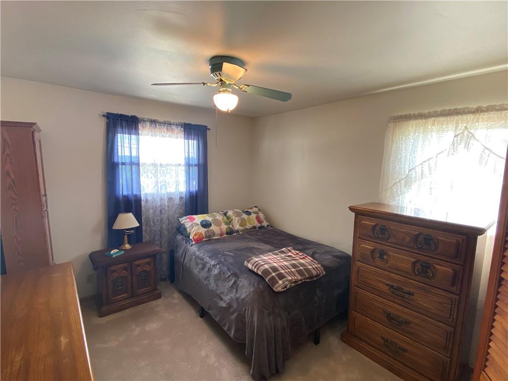 1009 Dutch Ridge Road Ellwood City, PA 16117 - Photo 6 of 12 a bedroom with a bed and window