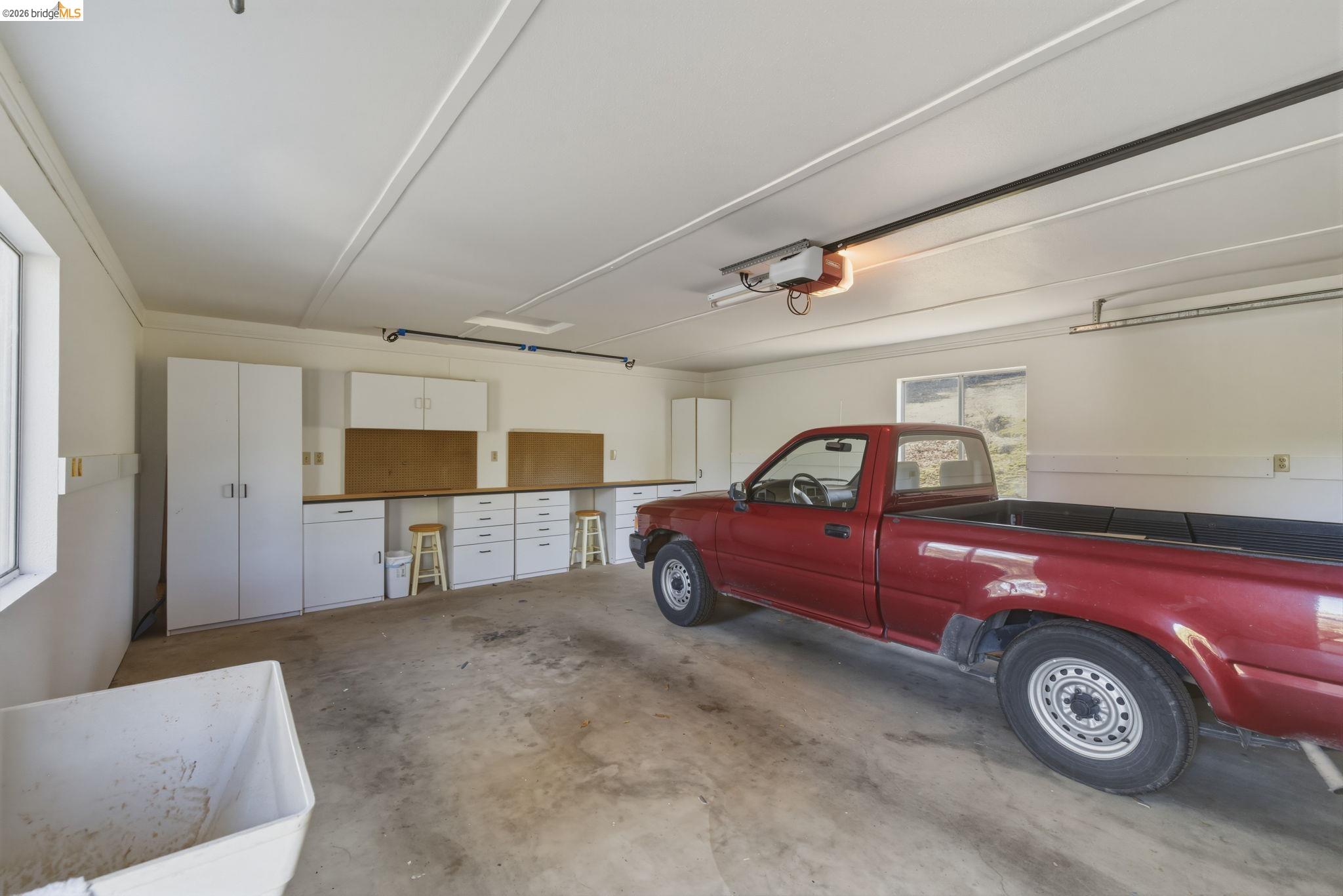 23401 Italian Bar Road Columbia, CA 95310 - Photo 13 of 49 a car parked in a garage