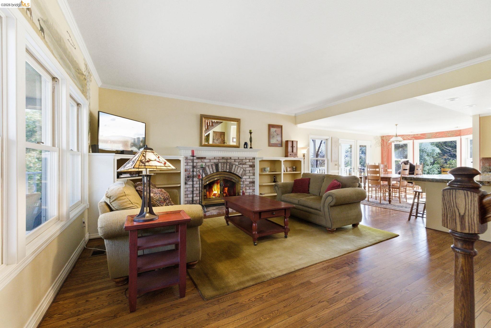 23401 Italian Bar Road Columbia, CA 95310 - Photo 2 of 49 a living room with furniture fireplace and a large window
