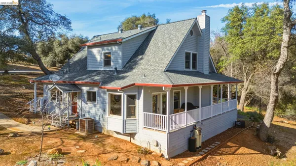 a view of a mountain with a forest