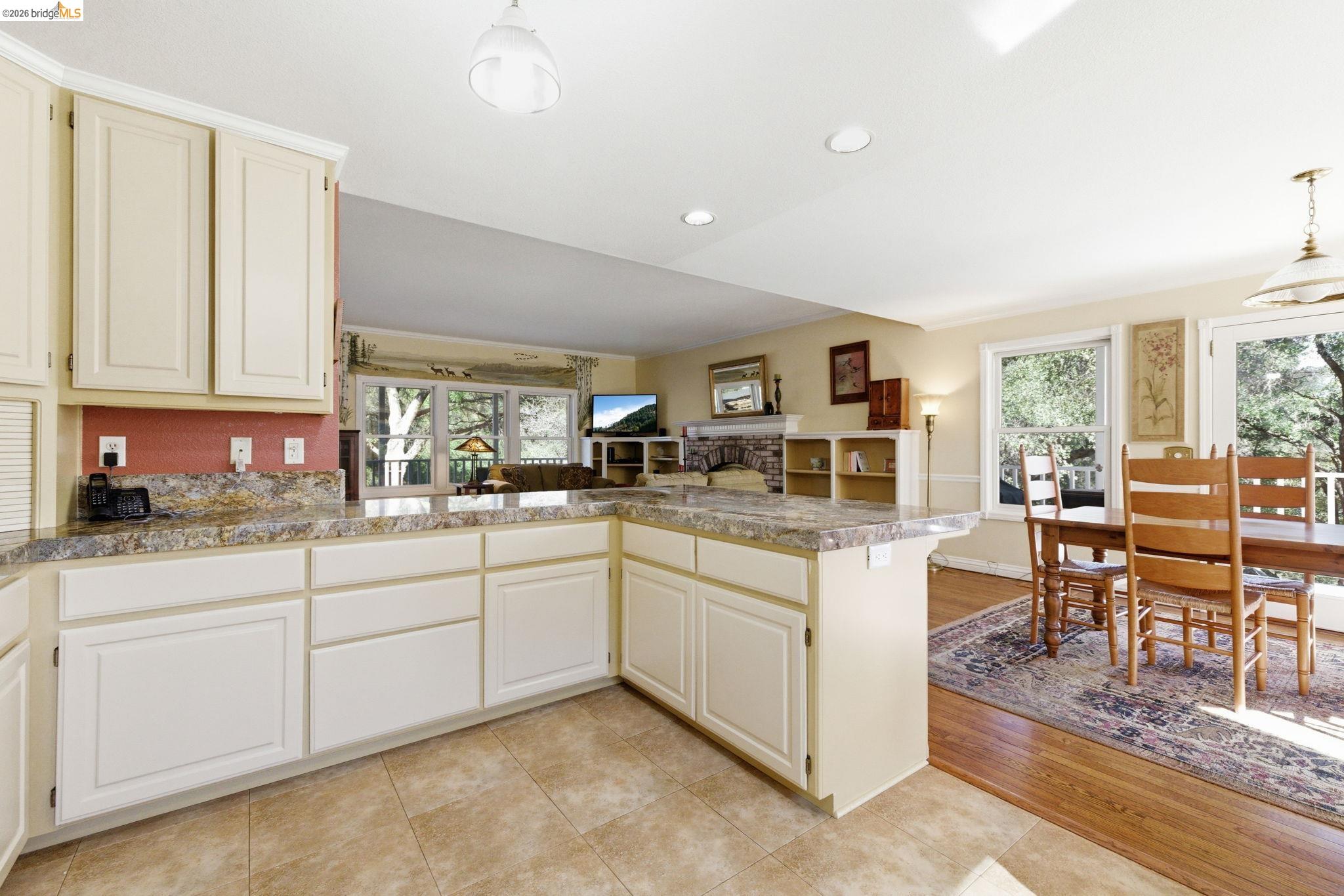23401 Italian Bar Road Columbia, CA 95310 - Photo 49 of 49 a kitchen with cabinets and chairs in it