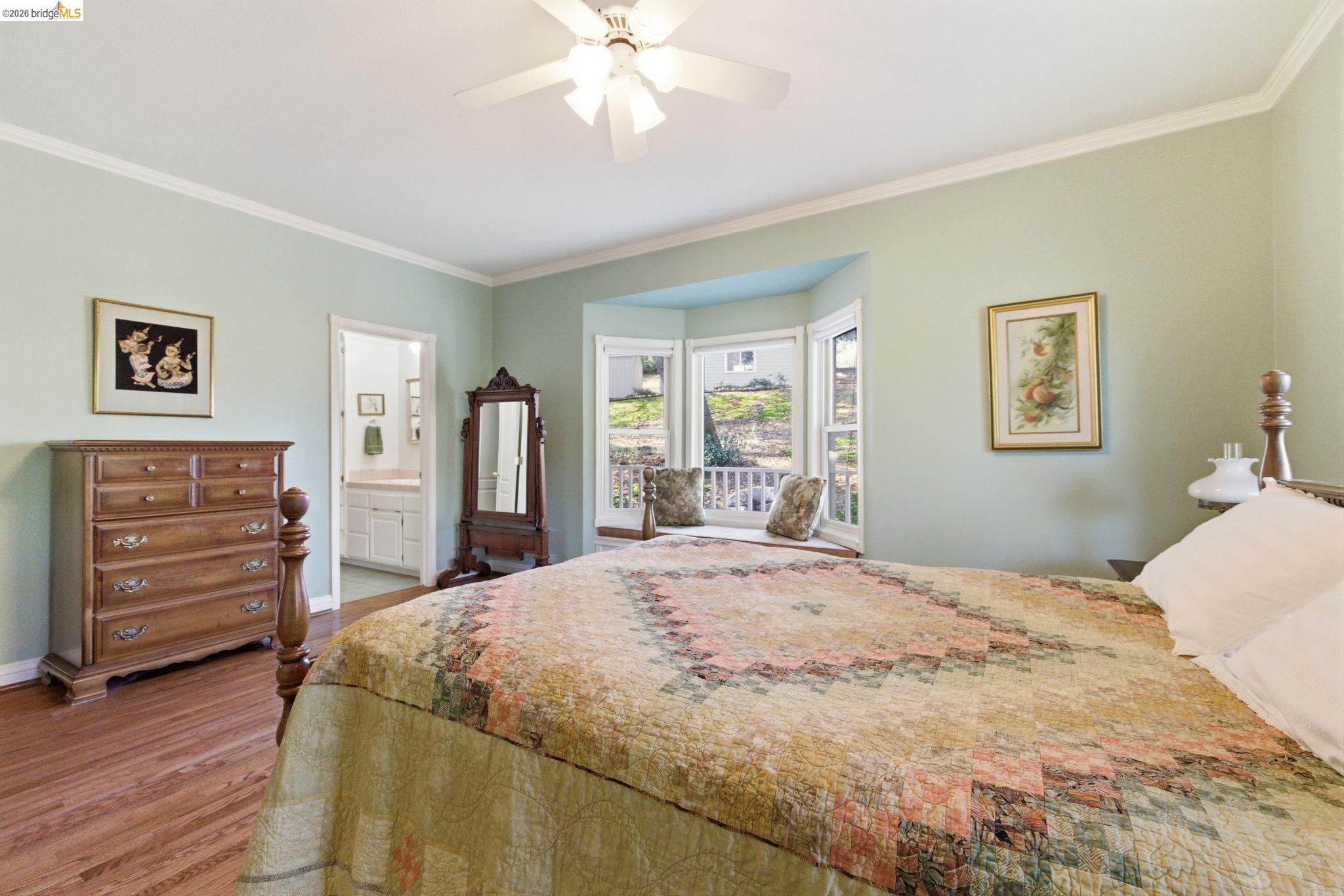 23401 Italian Bar Road Columbia, CA 95310 - Photo 28 of 49 a bedroom with a bed and wooden floor