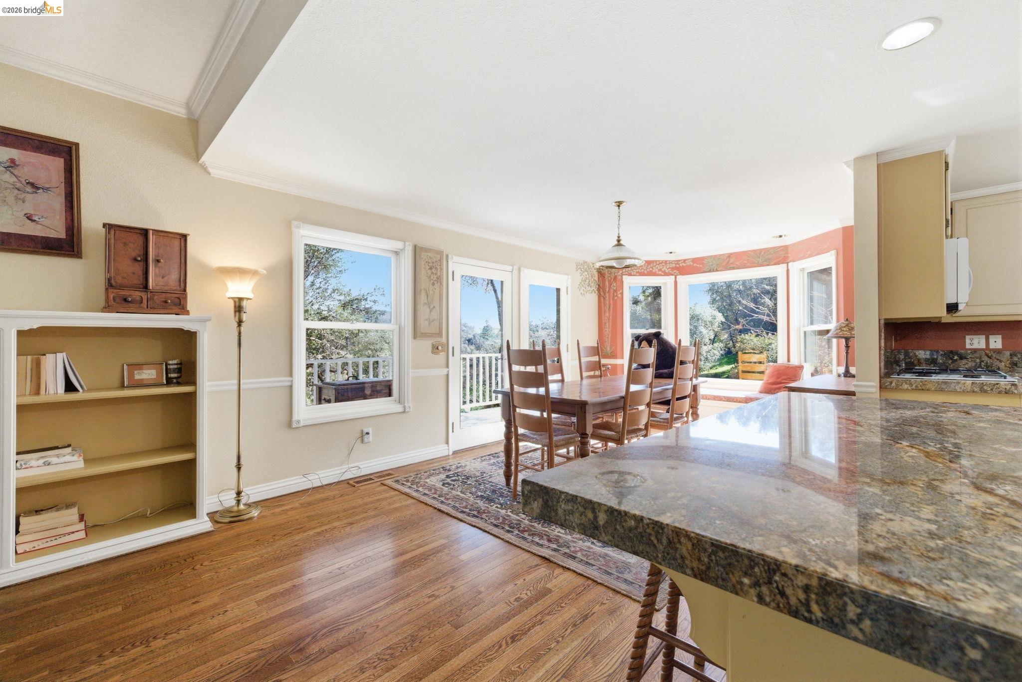 23401 Italian Bar Road Columbia, CA 95310 - Photo 31 of 49 a living room with furniture wooden floor and a floor to ceiling window