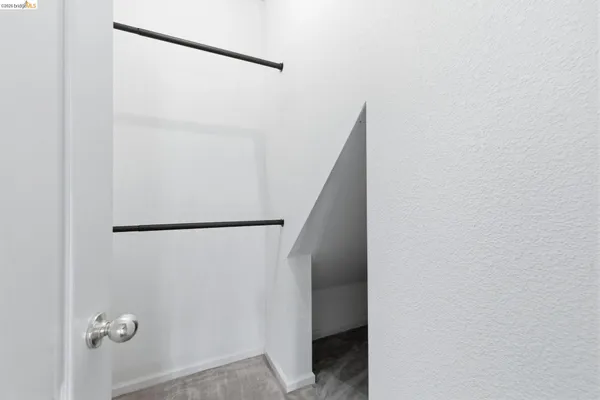a bathroom with a toilet sink vanity and mirror