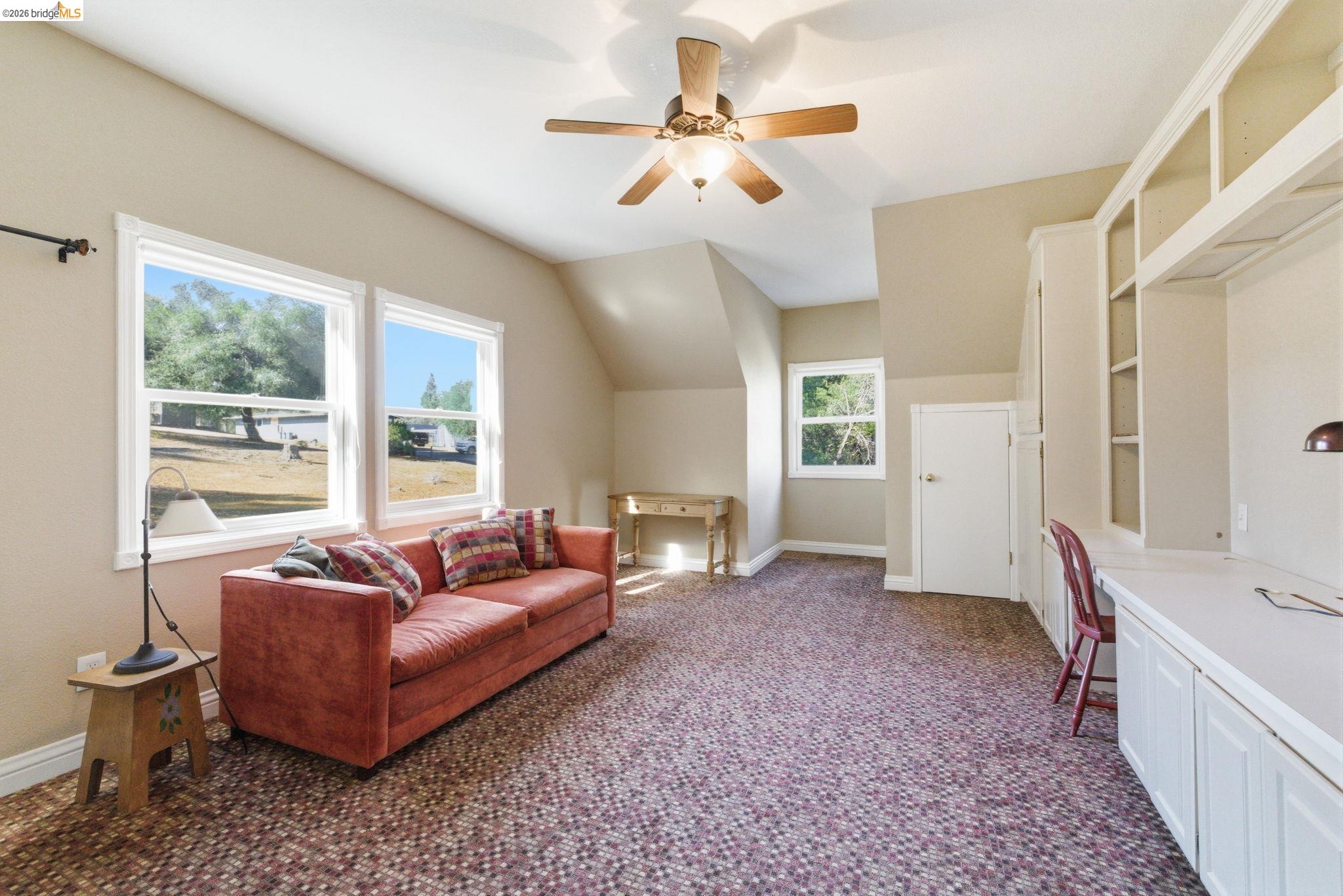 23401 Italian Bar Road Columbia, CA 95310 - Photo 40 of 49 a living room with furniture and a large window