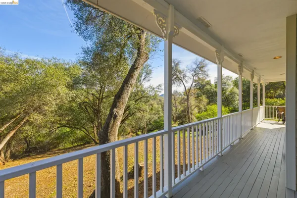 a view of a city street from a balcony