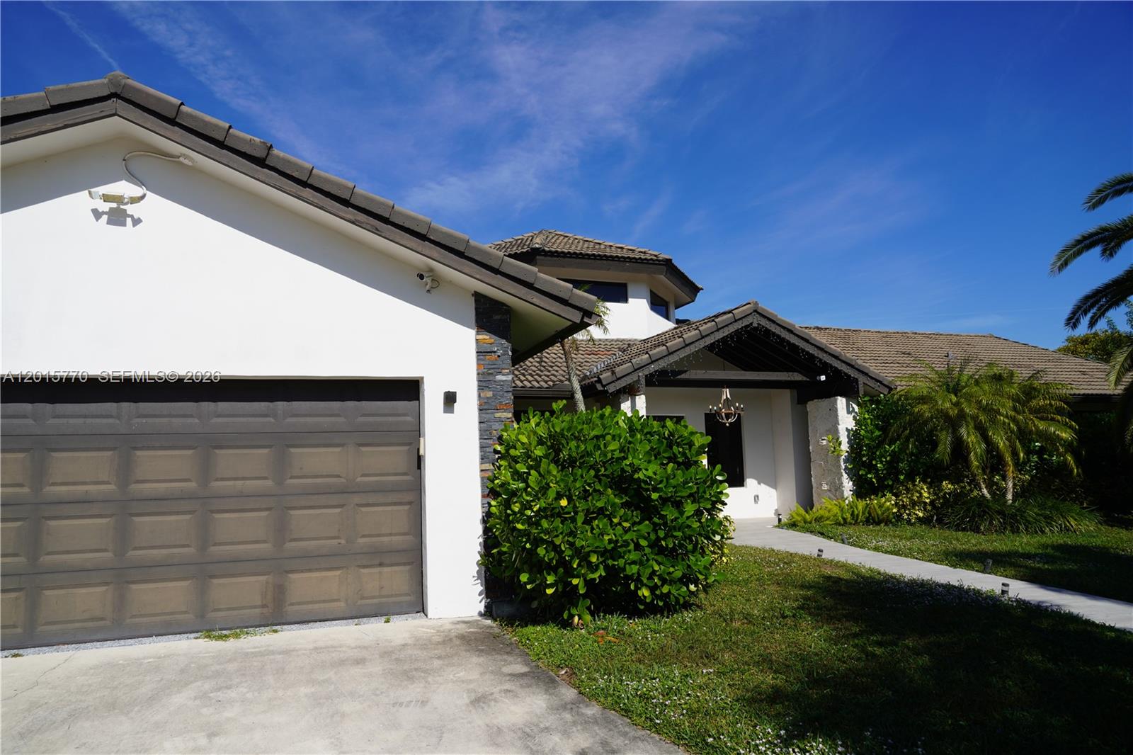 18901 Southwest 50th Street Southwest Ranches, FL 33332 - Photo 2 of 51 a front view of a house with a yard