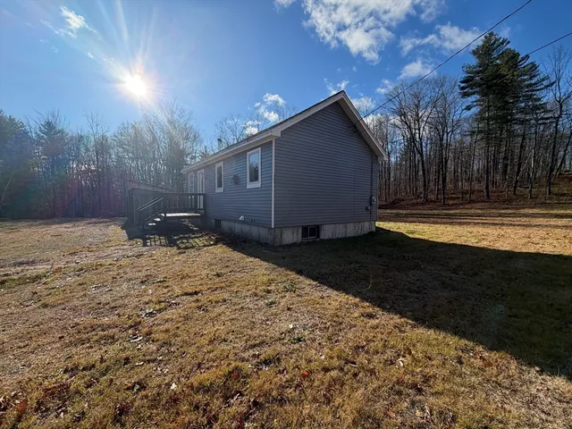 a view of a backyard of the house