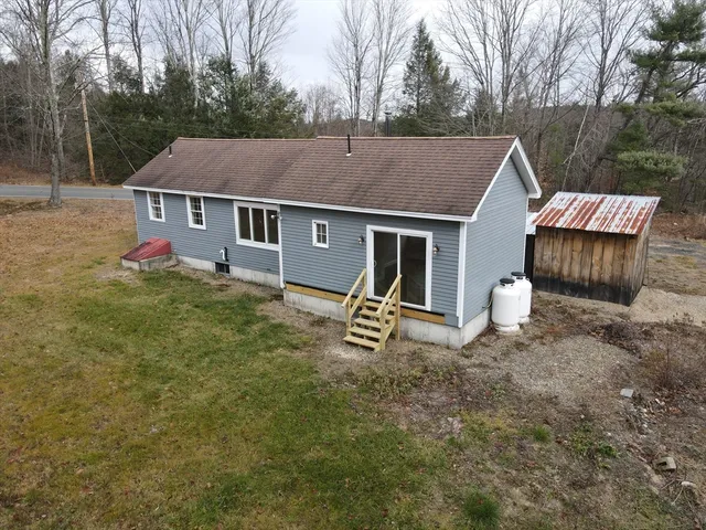 a view of a house with a yard and deck
