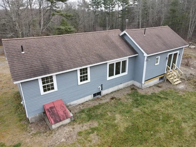 a aerial view of a house with a yard