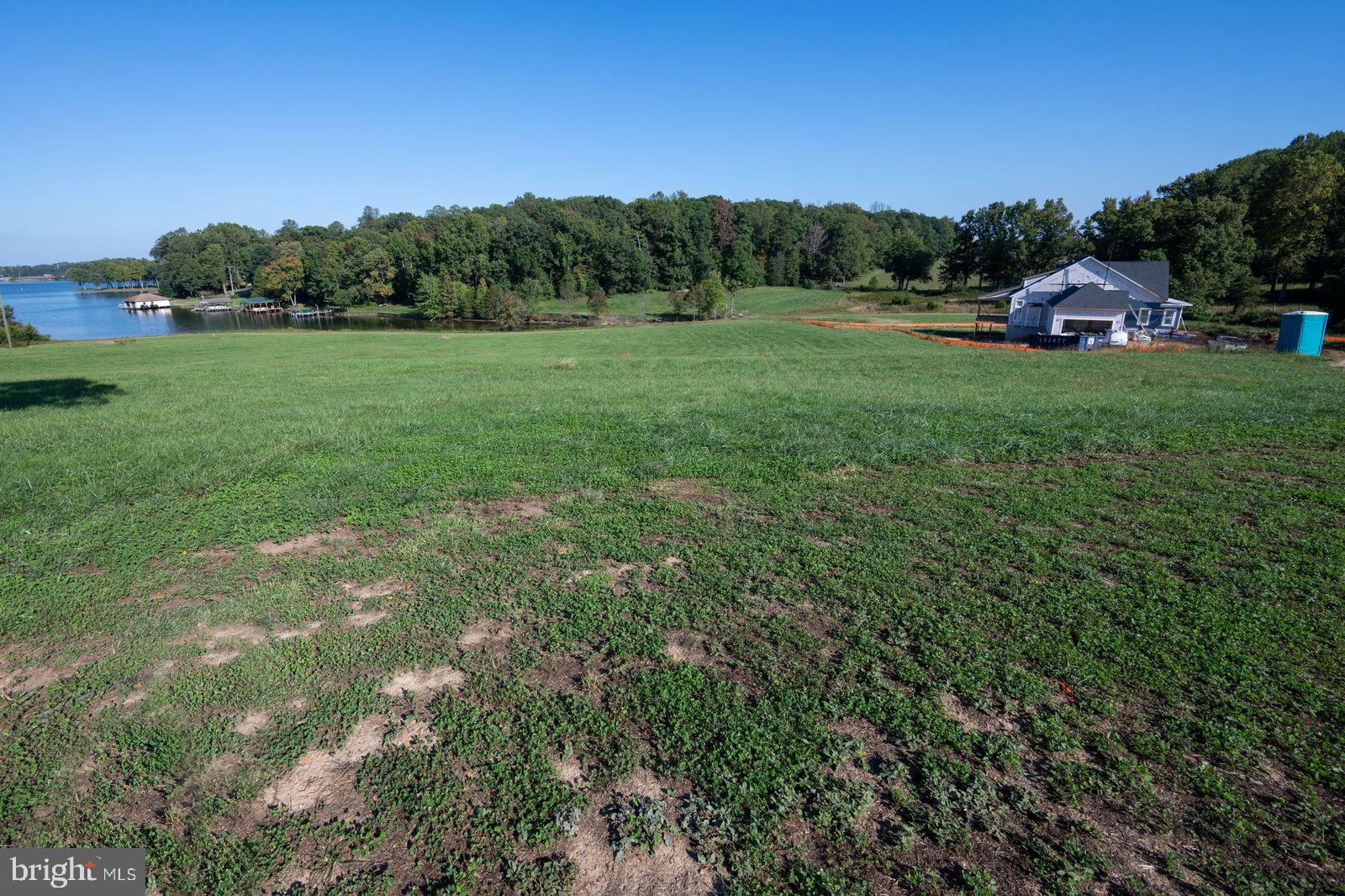 48 Rock Island Ridge Mineral, VA 23117 - Photo 3 of 6 a view of a grassy field with trees in the background