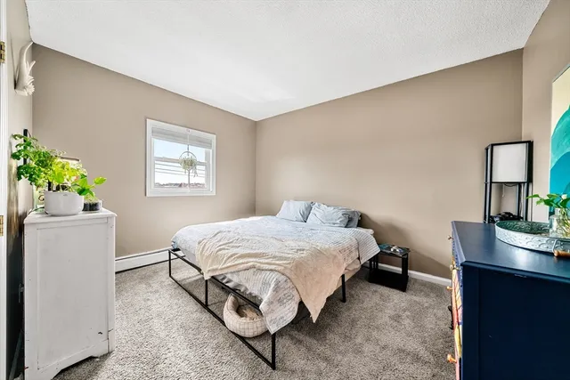 a bedroom with a bed and a table