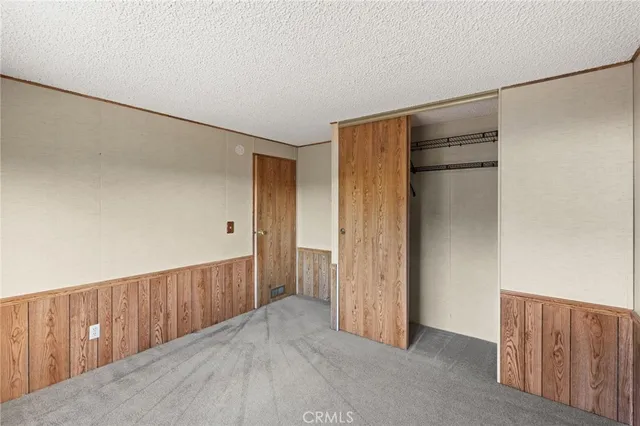 a view of hallway with wooden floor
