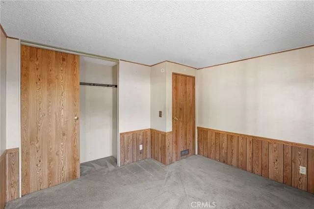 a view of a workspace with furniture and a potted plant