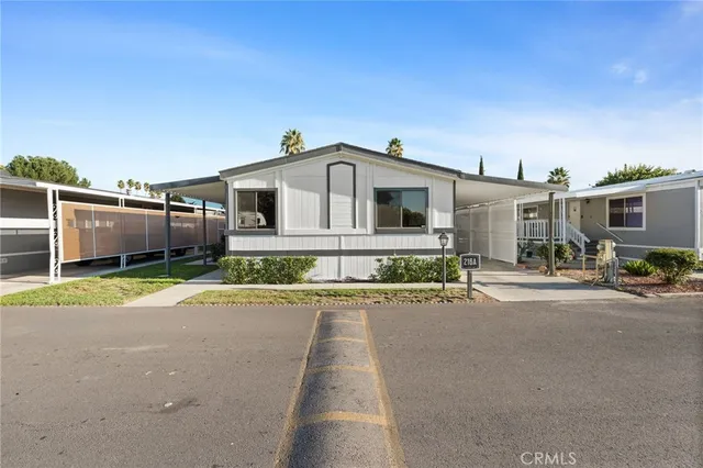 a front view of a house with a yard and a garage