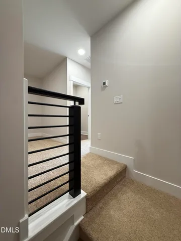 wooden floor in an empty room with stairs