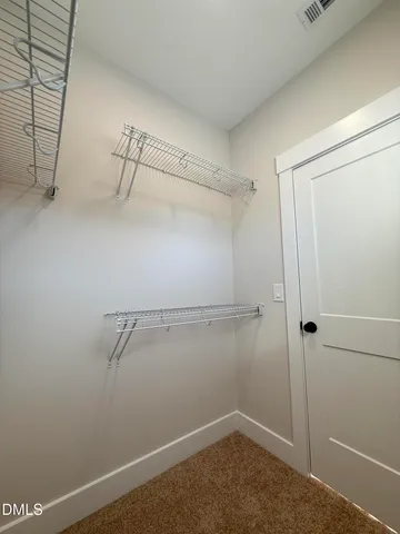 a spacious bathroom with a double vanity sink and a mirror