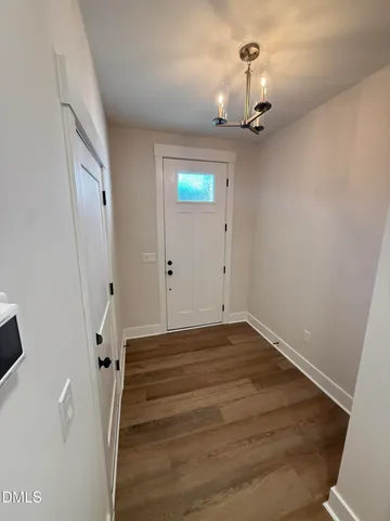 wooden floor with a bathroom