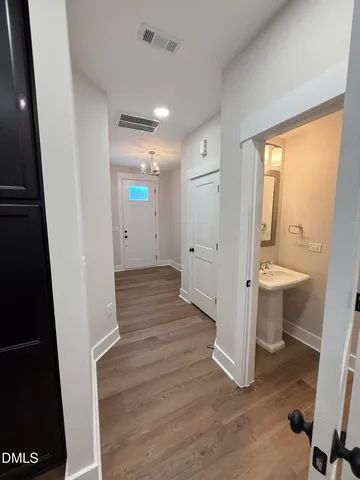 a large kitchen with stainless steel appliances granite countertop a sink a stove and a refrigerator