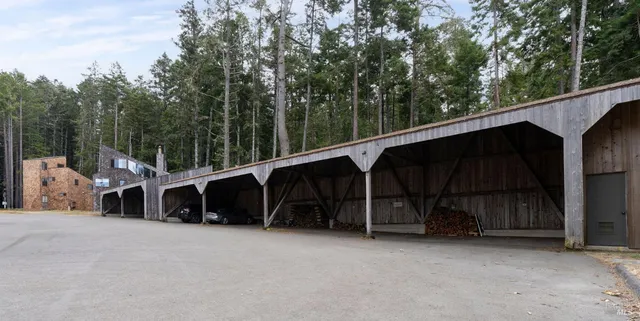 a living room with furniture and a painting on the wall