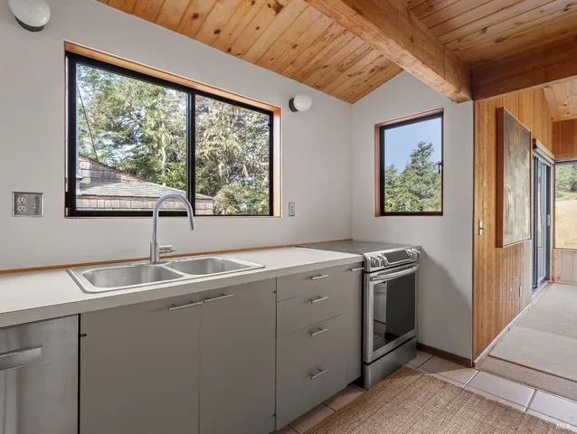 a bedroom with a bed and a chair