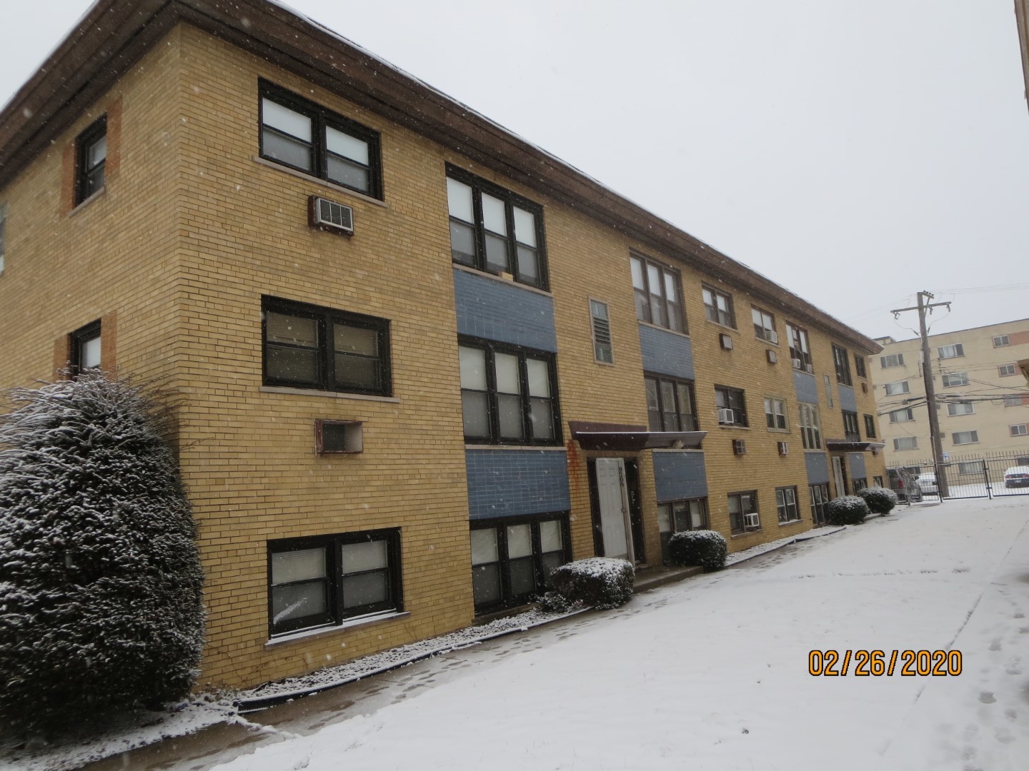 a front view of a building with a street